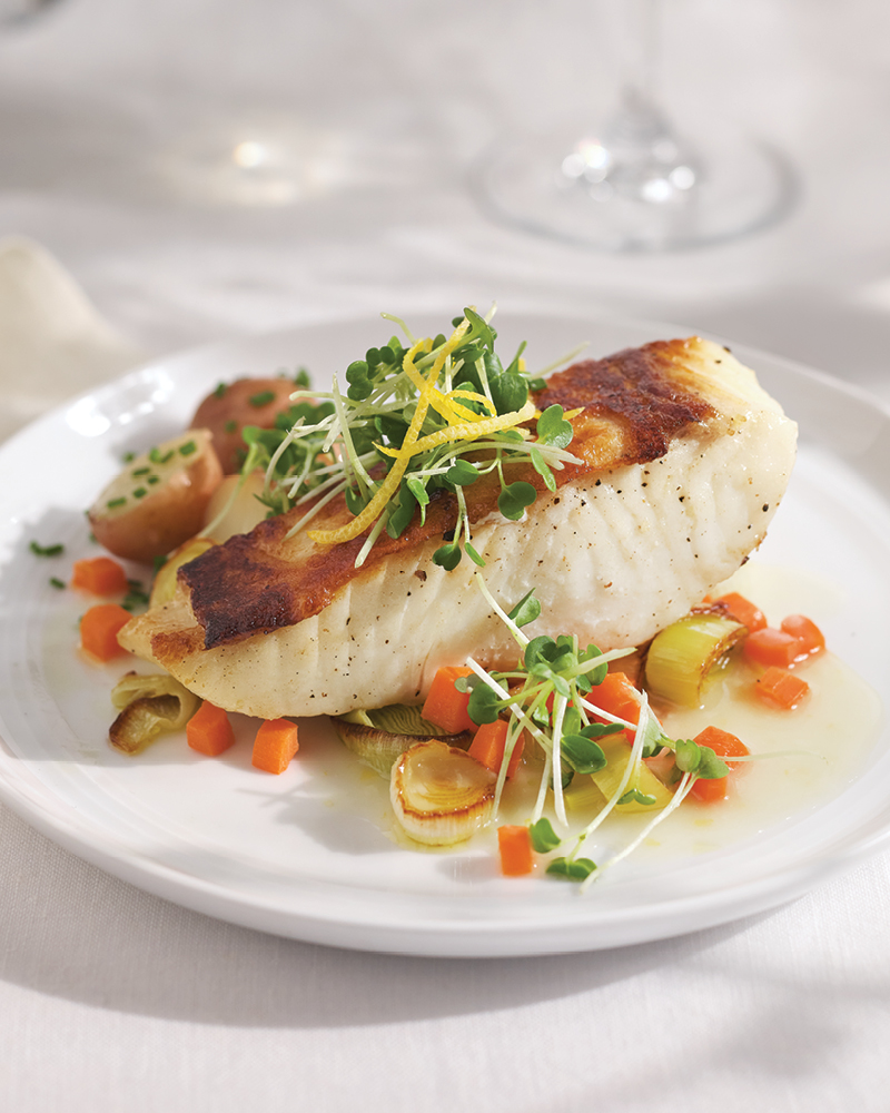 pan seared halibut with spring veggies and white wine sauce