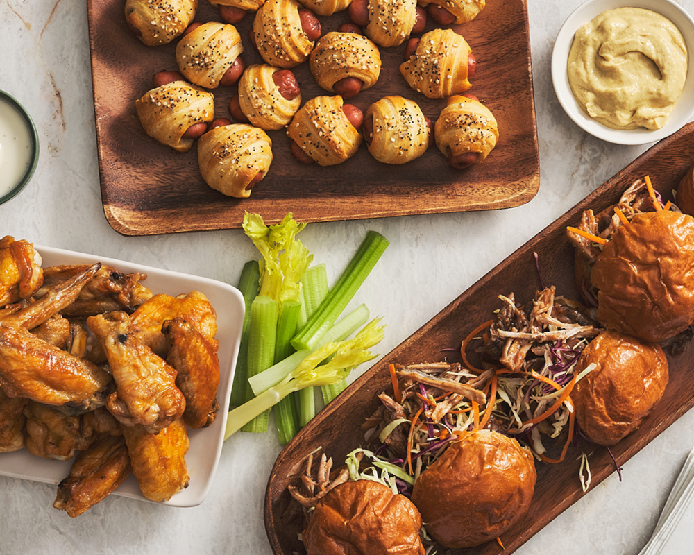 Pigs in a blanket, bbq pork sliders, and chicken wings