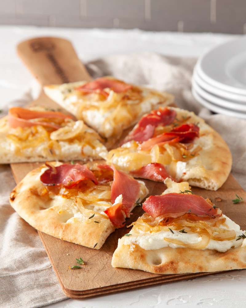 flatbread with sweet onions, goat cheese, and speck