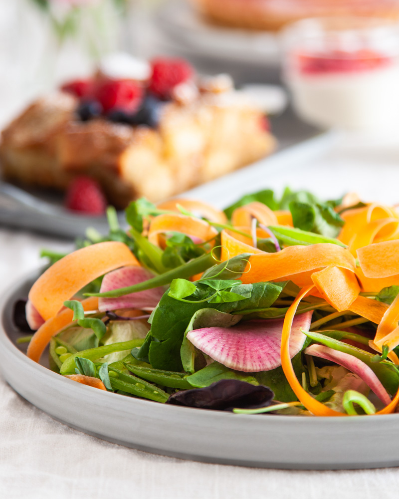 spring salad with carrot ribbons and watermelon radish
