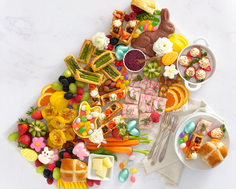 board filled with Easter candies and brunch bites