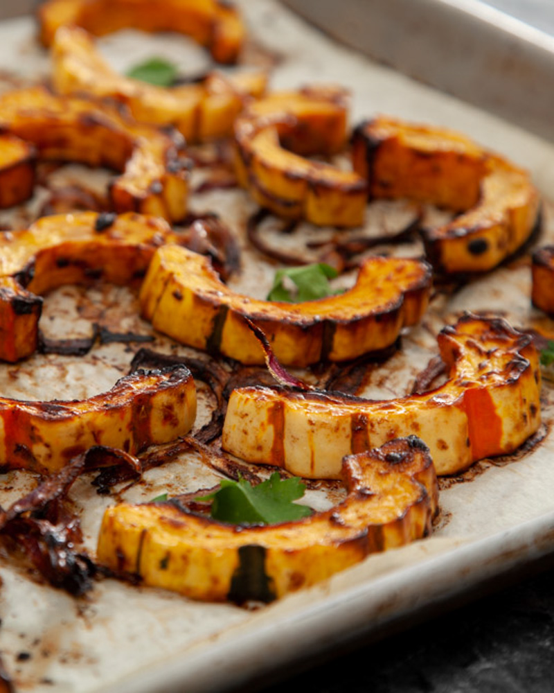 roasted delicata squash with black garlic and miso