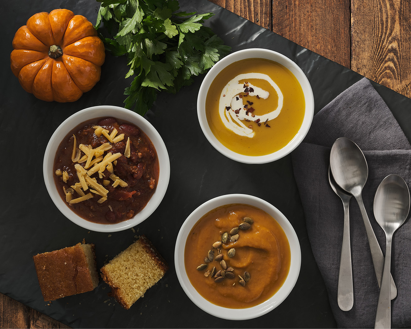 Bowls of chili, pumpkin bisque, and harvest butternut squash soup