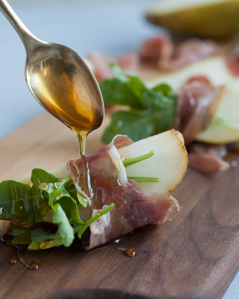 holiday pear wrapped in prosciutto