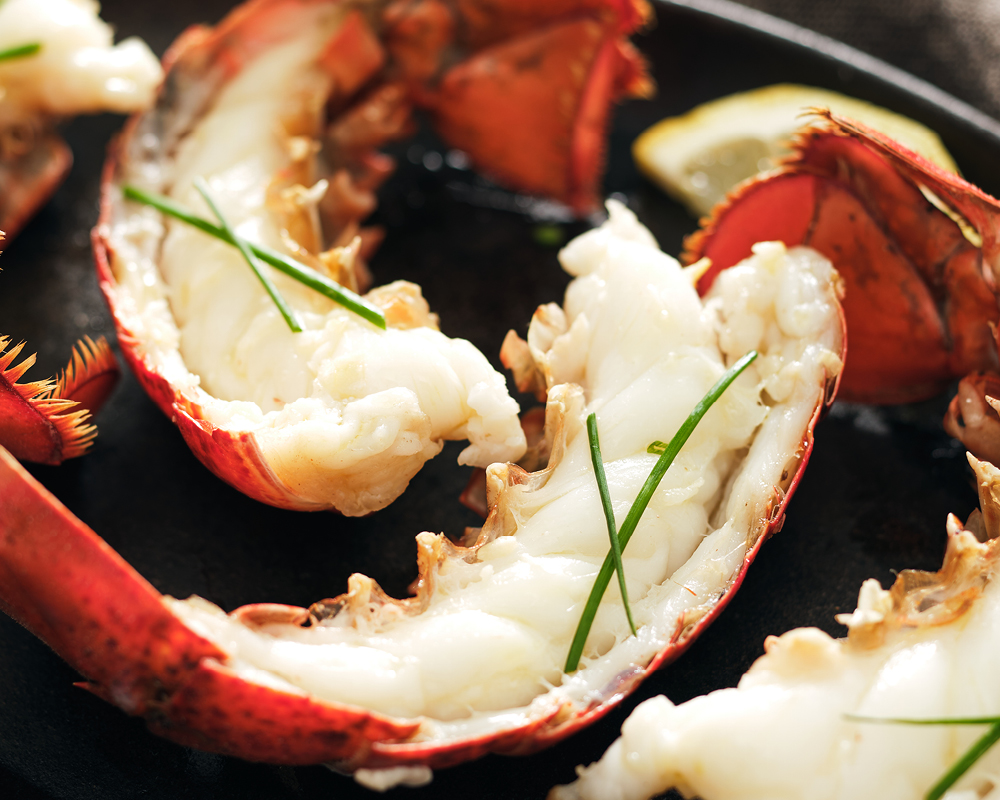 Lobster tails with green garnish