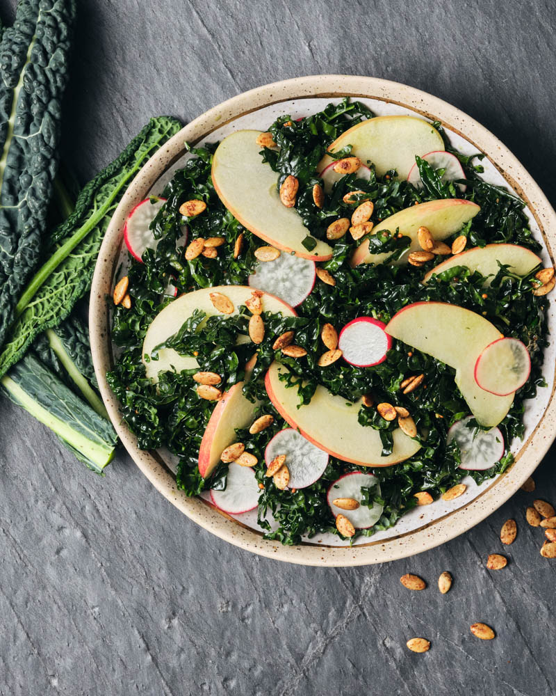 kale salad with apples and pumpkin seeds