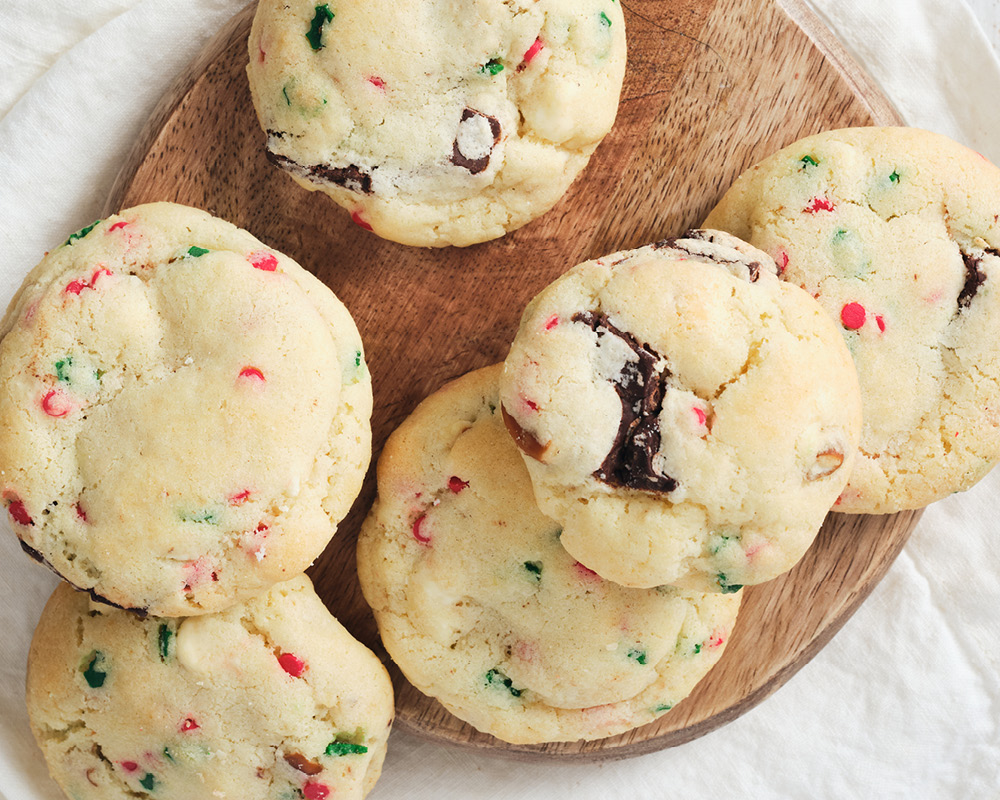 Santa's pantry cookies arranged on a wooden board on a white tablecloth