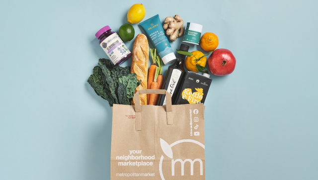 Grocery Bag with fall items coming out the top
