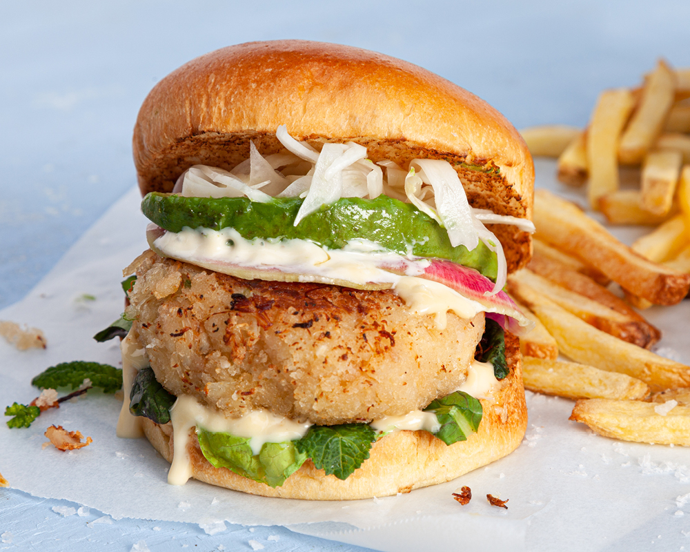 Crab cake sandwich on brioche bun with fries