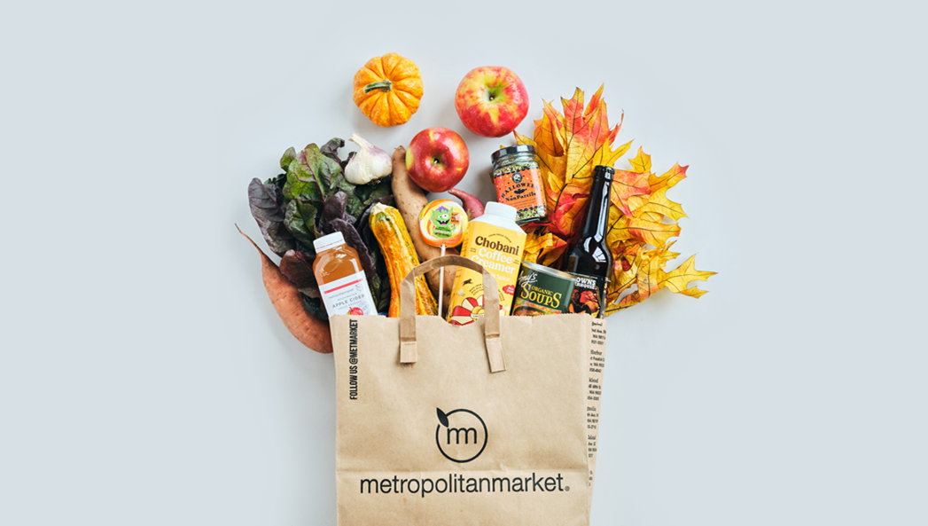 Grocery Bag with fall items coming out the top