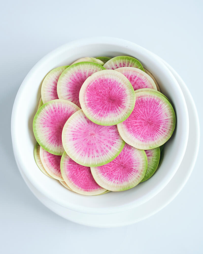 a bowl of watermelon radishes