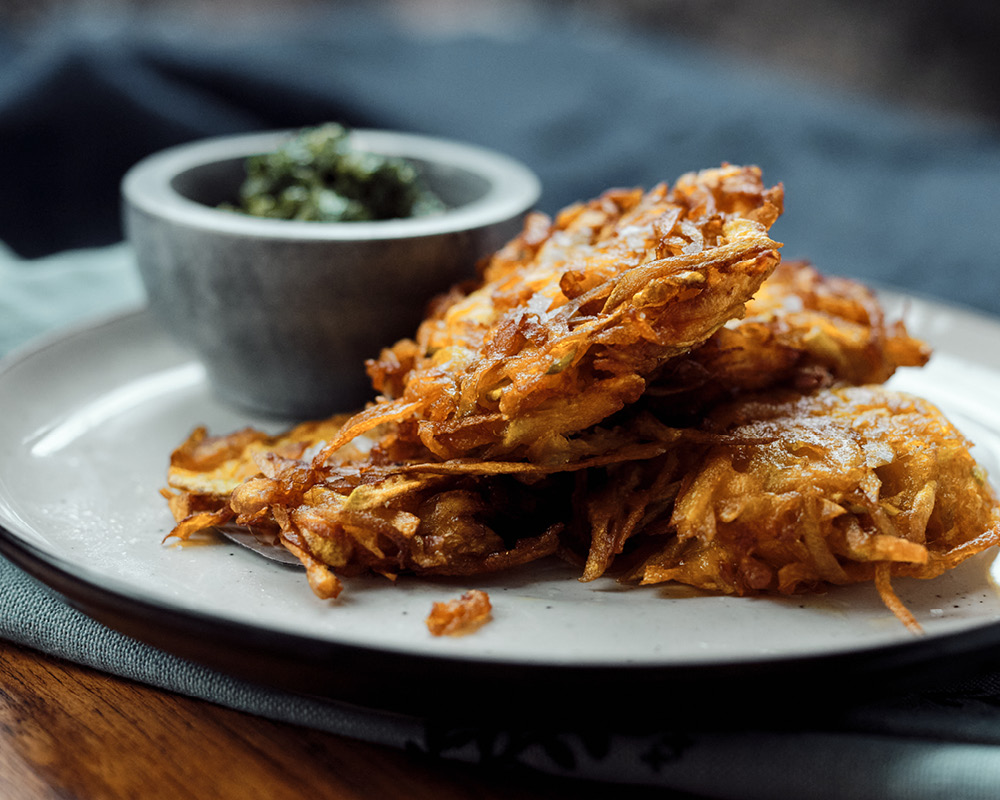 Squash Latkes plated with side of Cilantro Gremolata