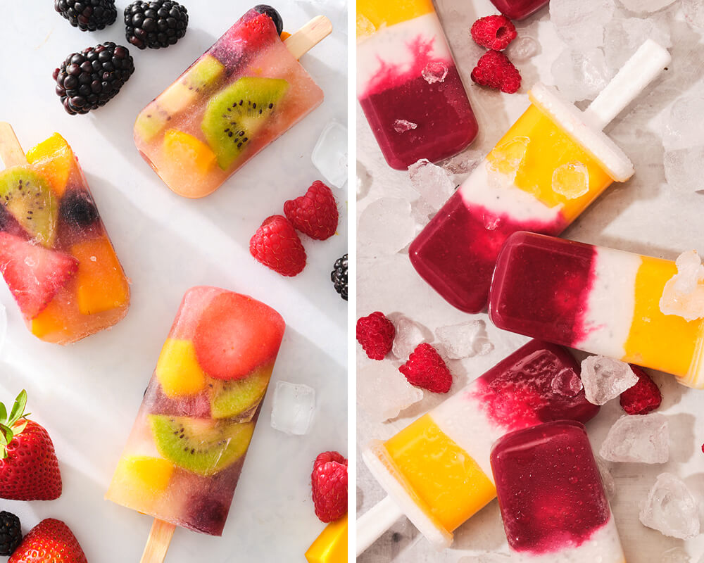 mixed fruit popsicles with berries and ice on a white background
