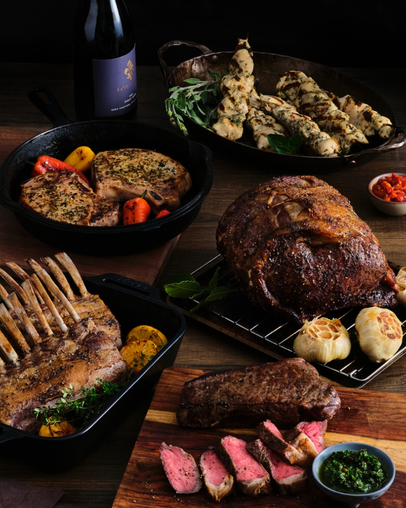 Assortment of Roasted Meats on Cutting Boards, Skillets, and Pans