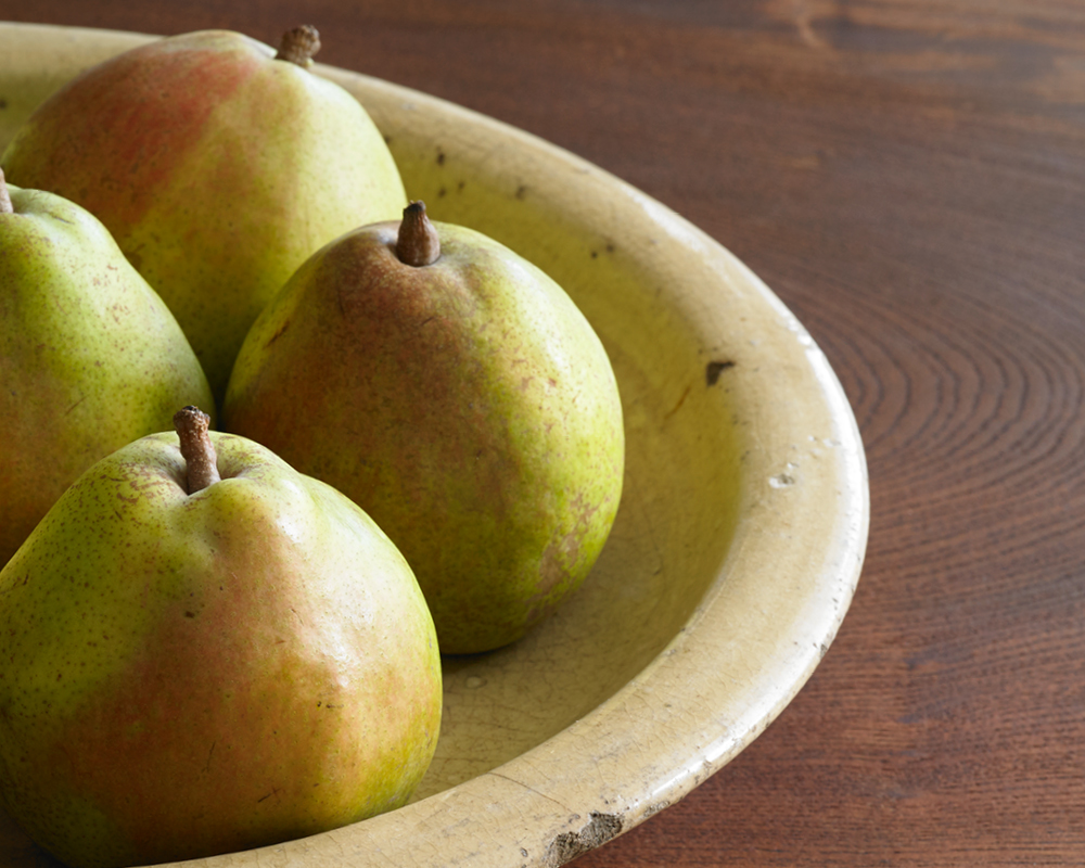 Four pears in a bowl