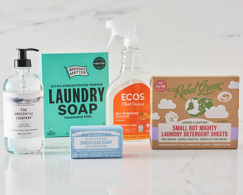 Cleaning products on shiny white marble background