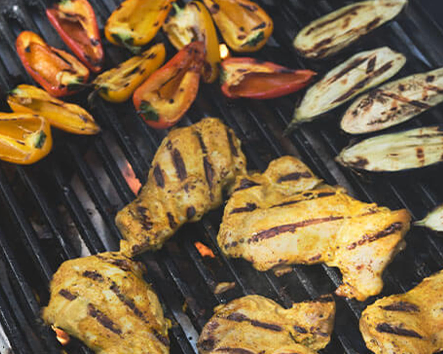 chicken and vegetables on a grill
