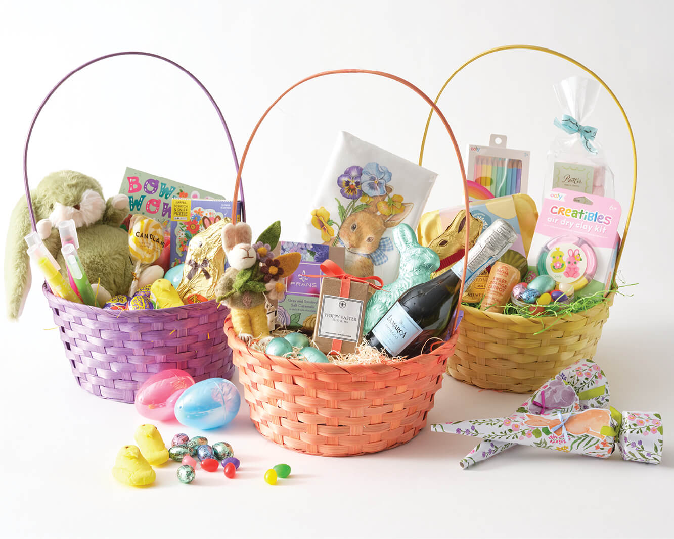 three easter baskets filled with candy and gifts