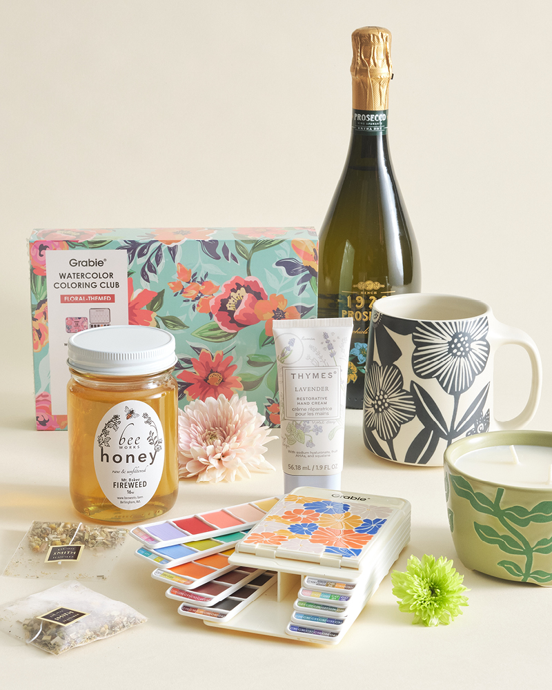 An assortment of gifts on cream background