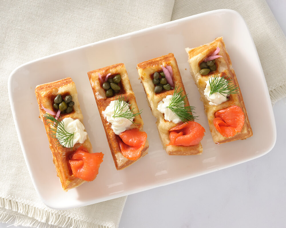 4 waffle strips 3 squares long filled with smoked salmon, mascarpone, and capers